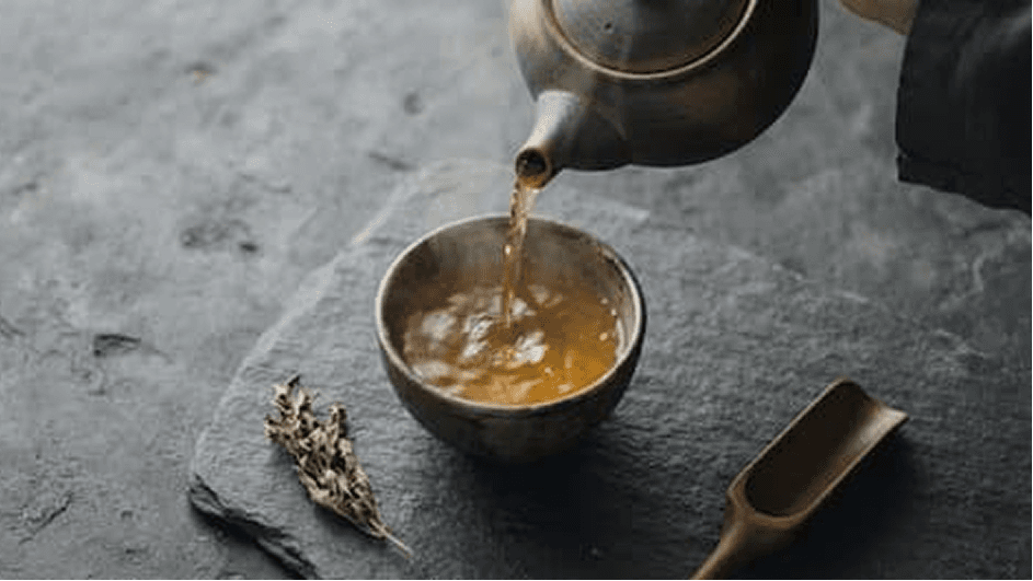 Bhutanese butter tea being poured into a traditional cup