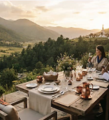 Private dining set above the valley at dusk